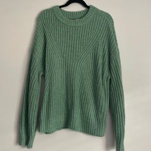 A new day light green sweater